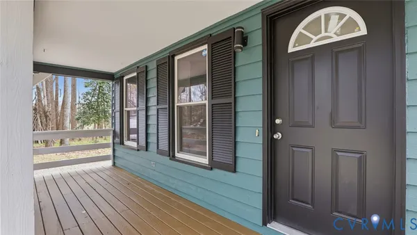 a view of front door with wooden floor