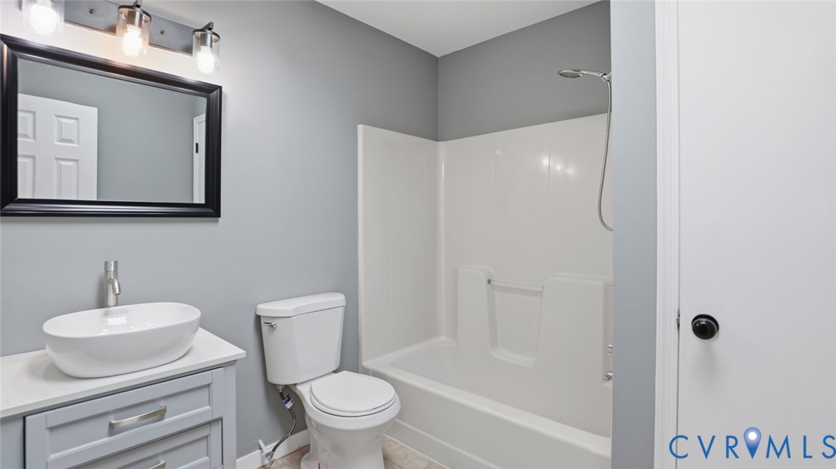 3063 Three Chopt Road Gum Spring, VA 23065 - Photo 28 of 45 a bathroom with a toilet sink and shower