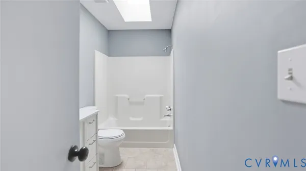 a large white kitchen with a window