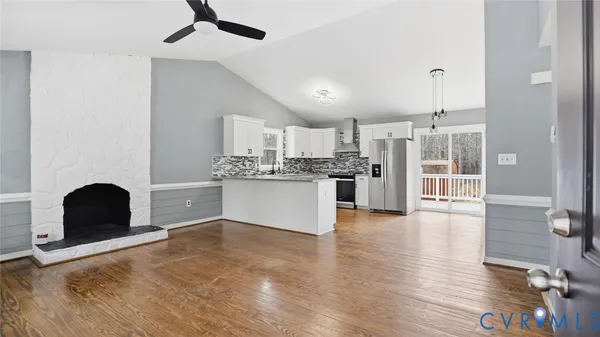 a view of kitchen with cabinets and wooden floor
