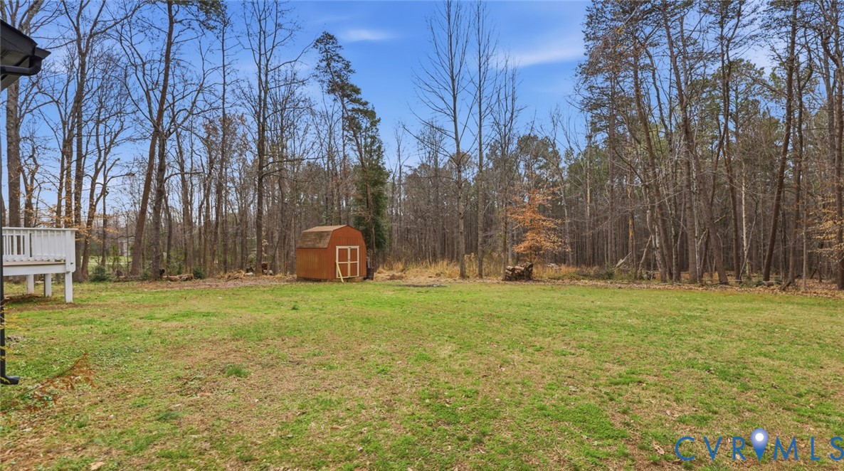 3063 Three Chopt Road Gum Spring, VA 23065 - Photo 32 of 45 a backyard of apartments with large trees