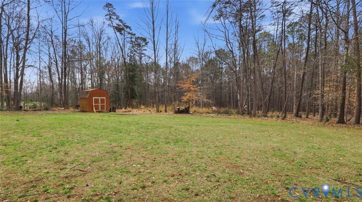 3063 Three Chopt Road Gum Spring, VA 23065 - Photo 33 of 45 a backyard of apartments with large trees