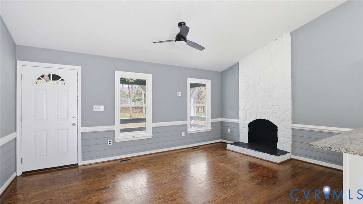 3063 Three Chopt Road Gum Spring, VA 23065 - Photo 4 of 45 a view of an empty room with wooden floor and a window