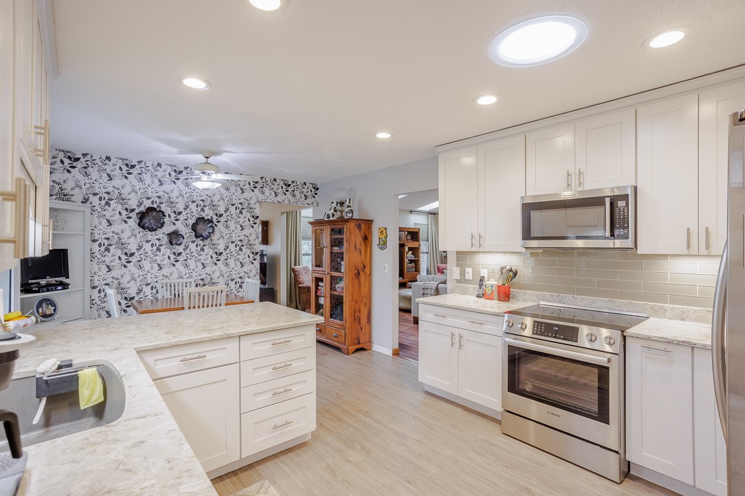 540 Basil Street Springboro, OH 45066 - Photo 7 of 32 This bright kitchen features sleek appliances and ample counter space, perfect for culinary endeavors.