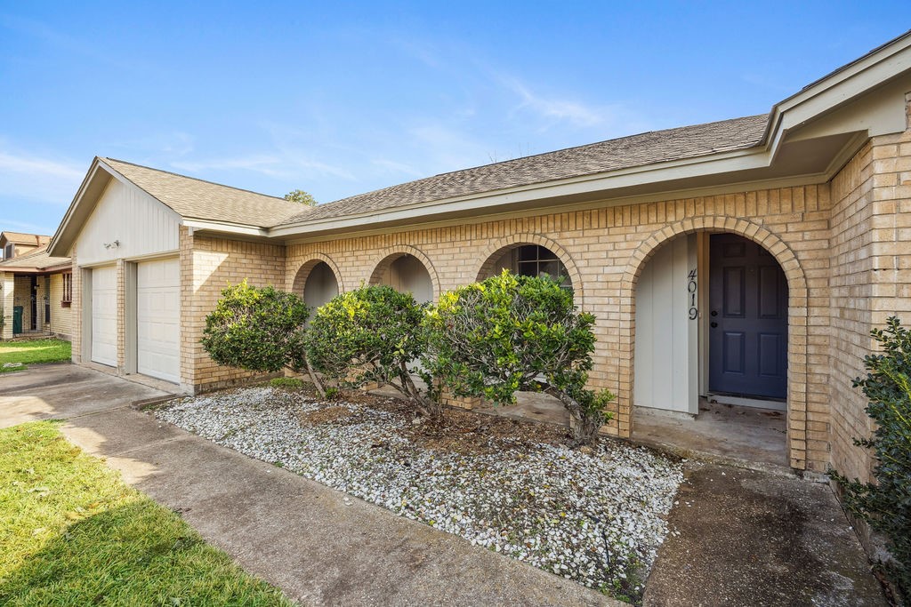 4019 Danpree Street Pasadena, TX 77504 - Photo 3 of 20 a front view of a house with garden