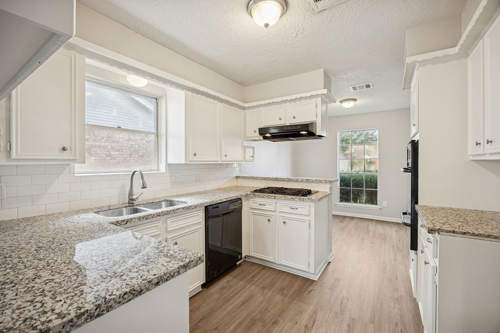 4019 Danpree Street Pasadena, TX 77504 - Photo 5 of 20 a kitchen with stainless steel appliances granite countertop a sink stove and refrigerator