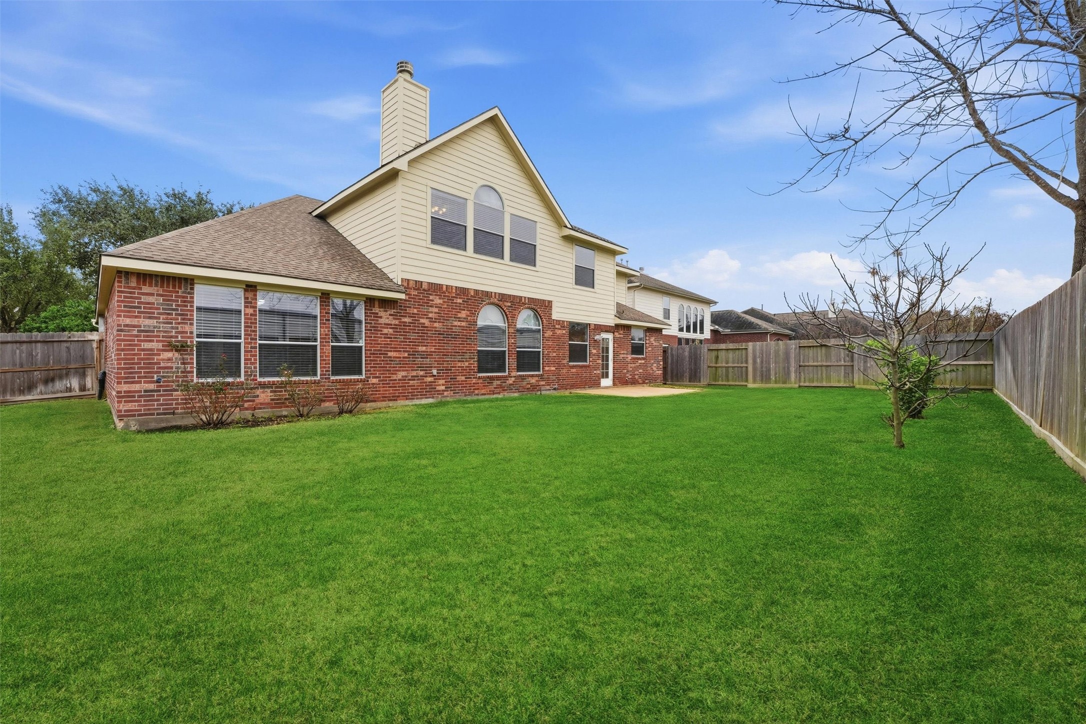 17415 Memorial Mills Drive Spring, TX 77379 - Photo 33 of 37 Rear elevation showing brick and siding exterior with multiple windows for natural light.