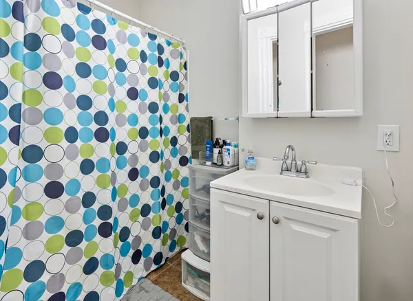 a utility room with cabinets washer and dryer