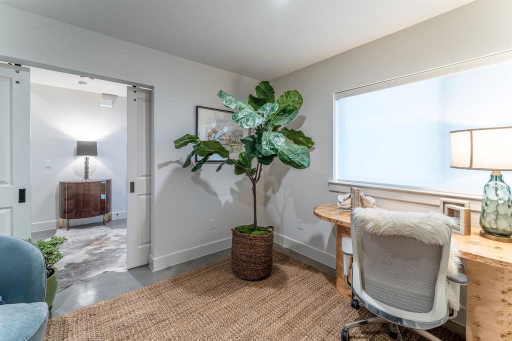 13900 Noel Road, Unit 203 Dallas, TX 75240 - Photo 3 of 11 a room with furniture and potted plant