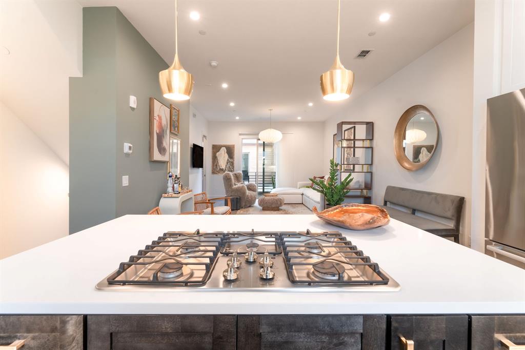 13900 Noel Road, Unit 203 Dallas, TX 75240 - Photo 6 of 11 a large kitchen with a table and chairs