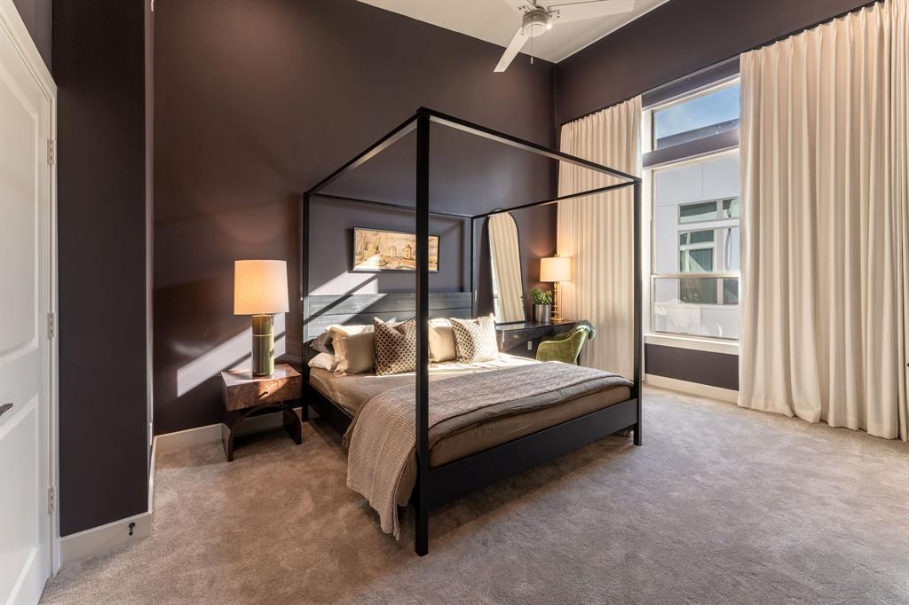 13900 Noel Road, Unit 203 Dallas, TX 75240 - Photo 9 of 11 a bed room with a bed and a window