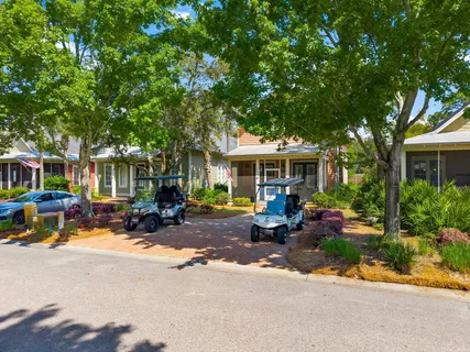 a balcony with furniture and wooden floor