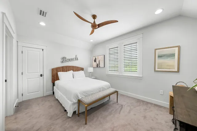 a bed room with a bed and a window