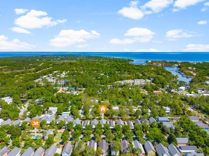 a view of balcony with wooden floor and fence
