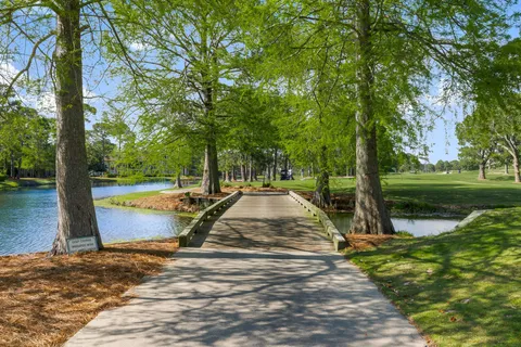 a view of balcony with wooden floor and fence