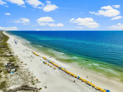 a front view of a house with outdoor seating