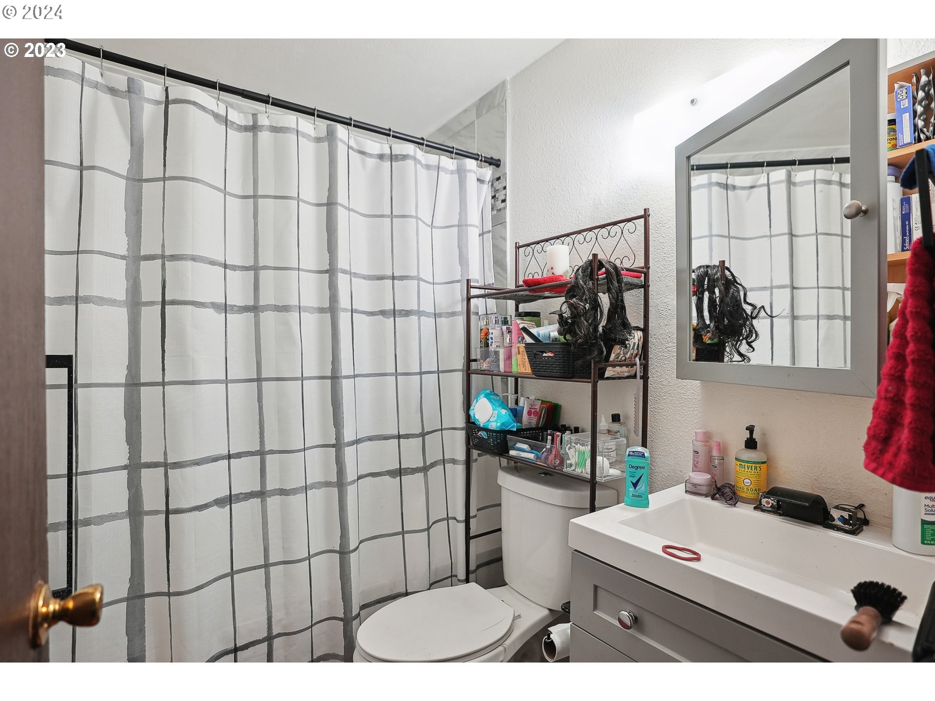 9630 Southeast Foster Road Portland, OR 97266 - Photo 21 of 33 a bathroom with a sink and a shower curtain