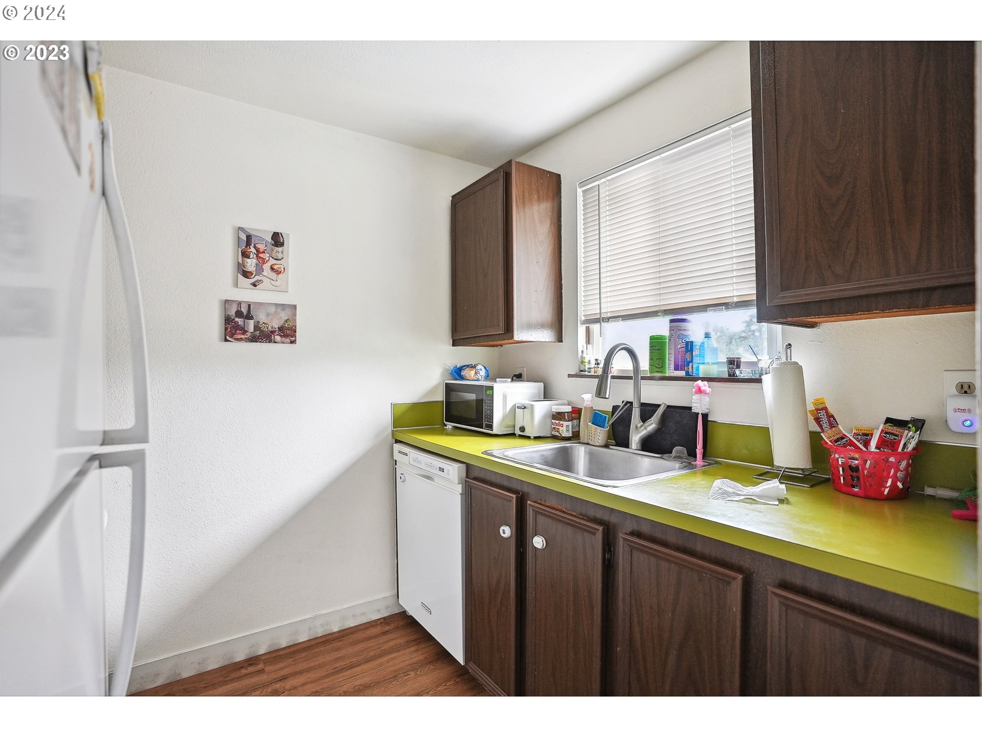 9630 Southeast Foster Road Portland, OR 97266 - Photo 23 of 33 a kitchen with a sink cabinets and wooden floor