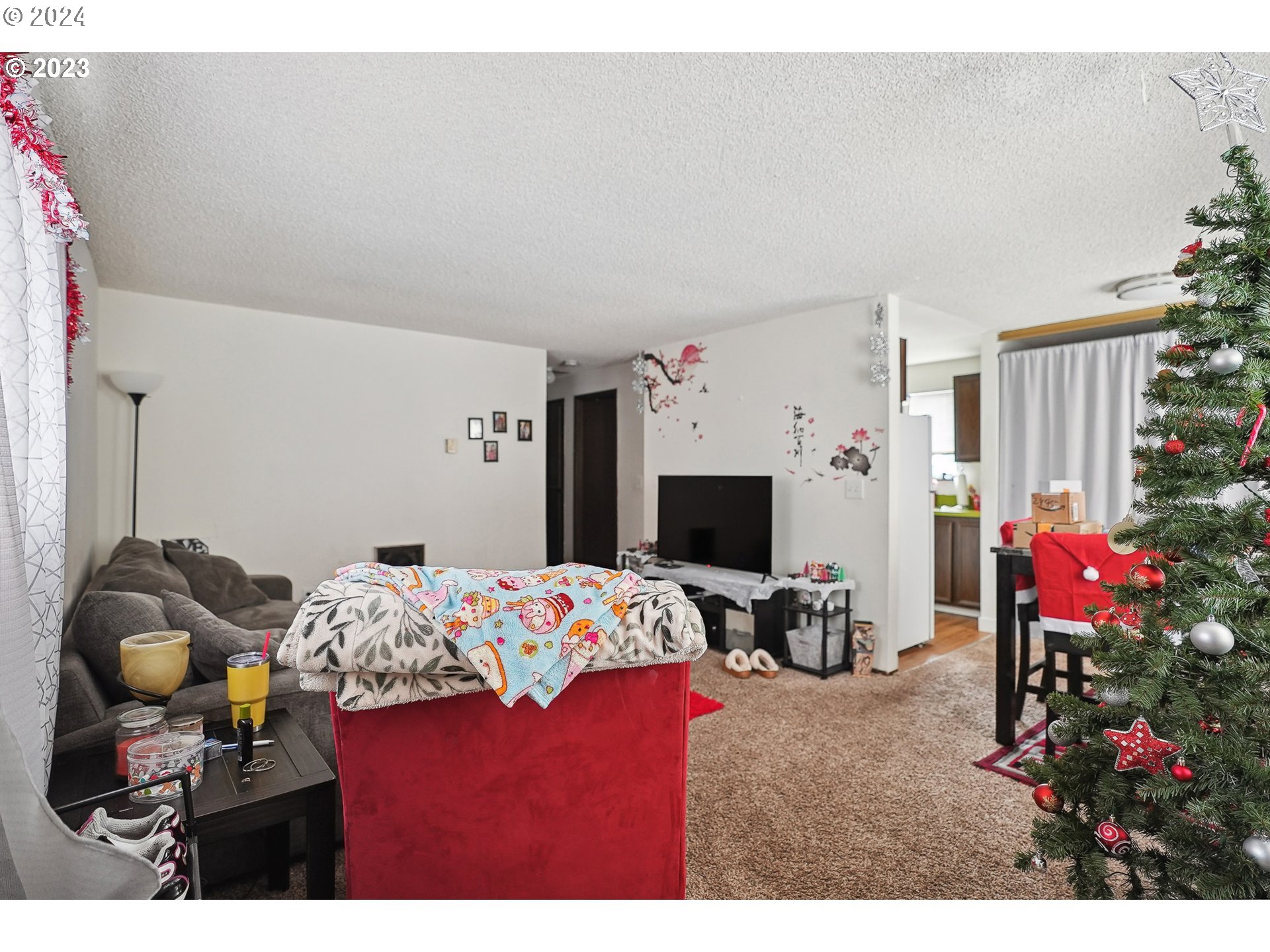 9630 Southeast Foster Road Portland, OR 97266 - Photo 24 of 33 a bedroom with a bed and a flat screen tv