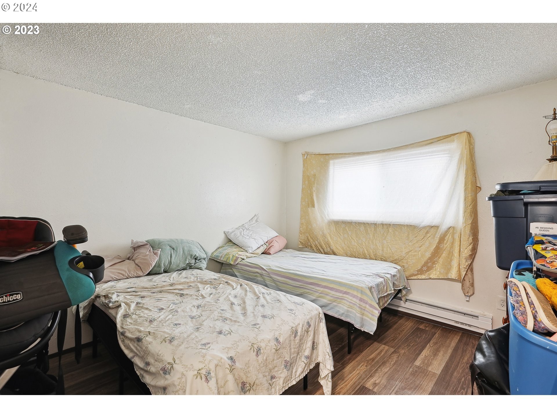 9630 Southeast Foster Road Portland, OR 97266 - Photo 7 of 33 a bedroom with a bed and a flat screen tv