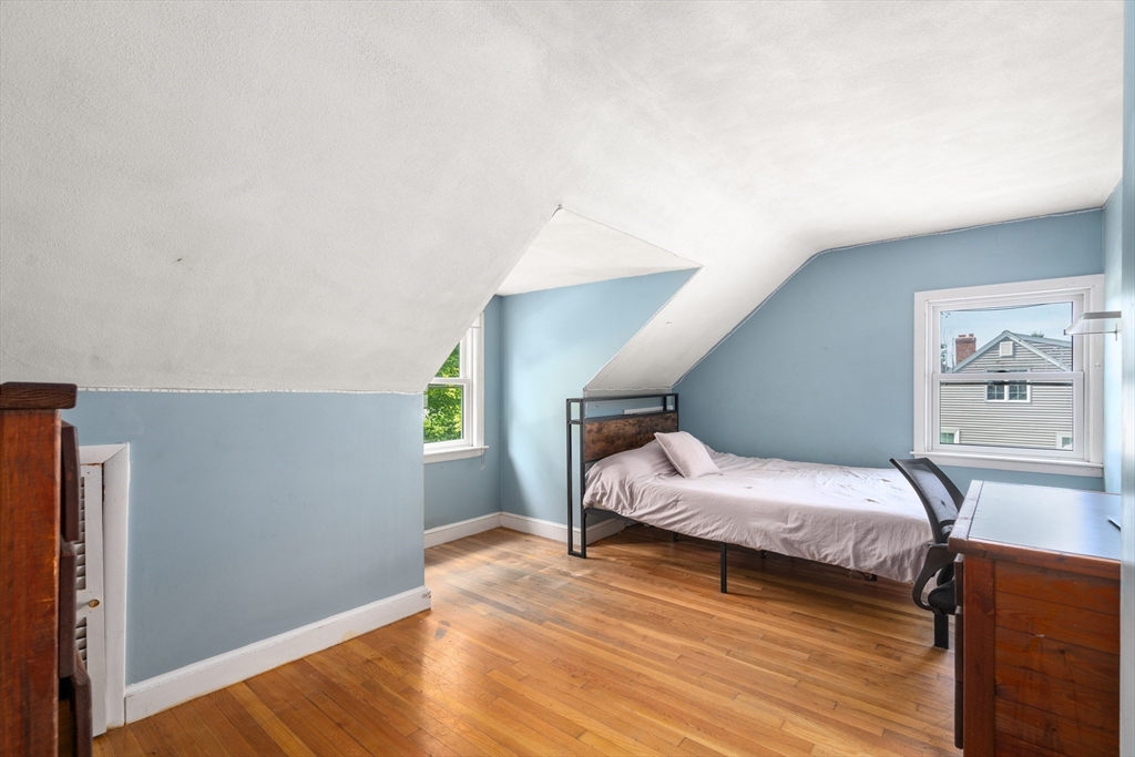 34 Irving Drive Walpole, MA 02081 - Photo 14 of 20 a bedroom with two beds and wooden floor