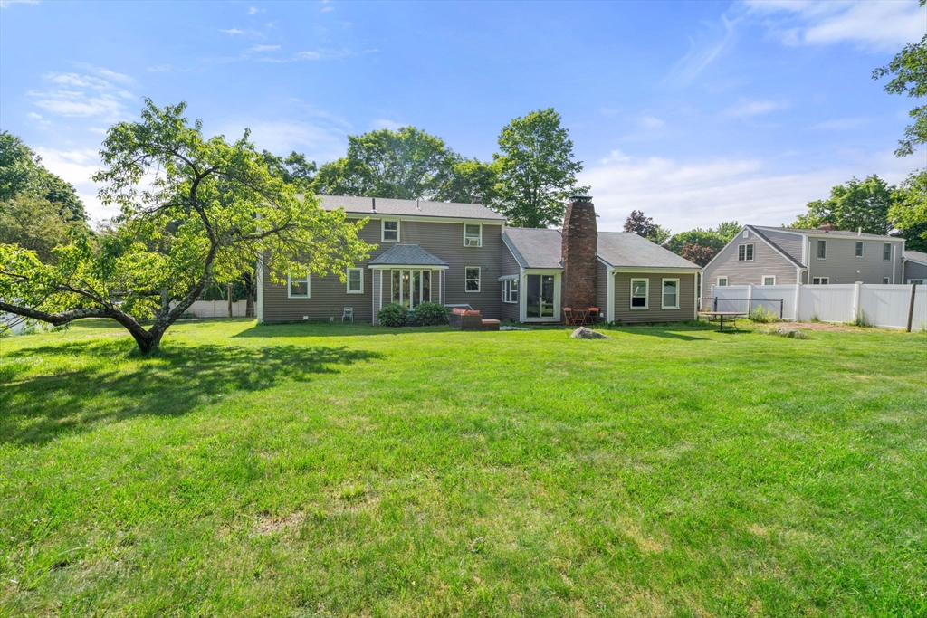 34 Irving Drive Walpole, MA 02081 - Photo 17 of 20 a house view with garden space and trees