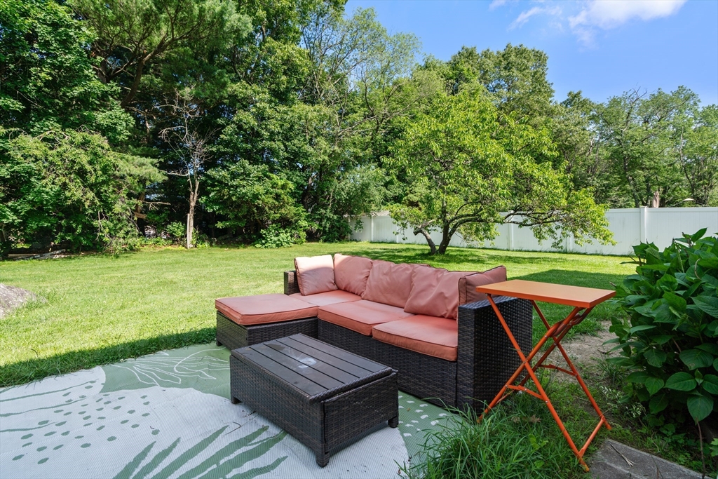 34 Irving Drive Walpole, MA 02081 - Photo 2 of 20 a view of a yard with furniture and a garden