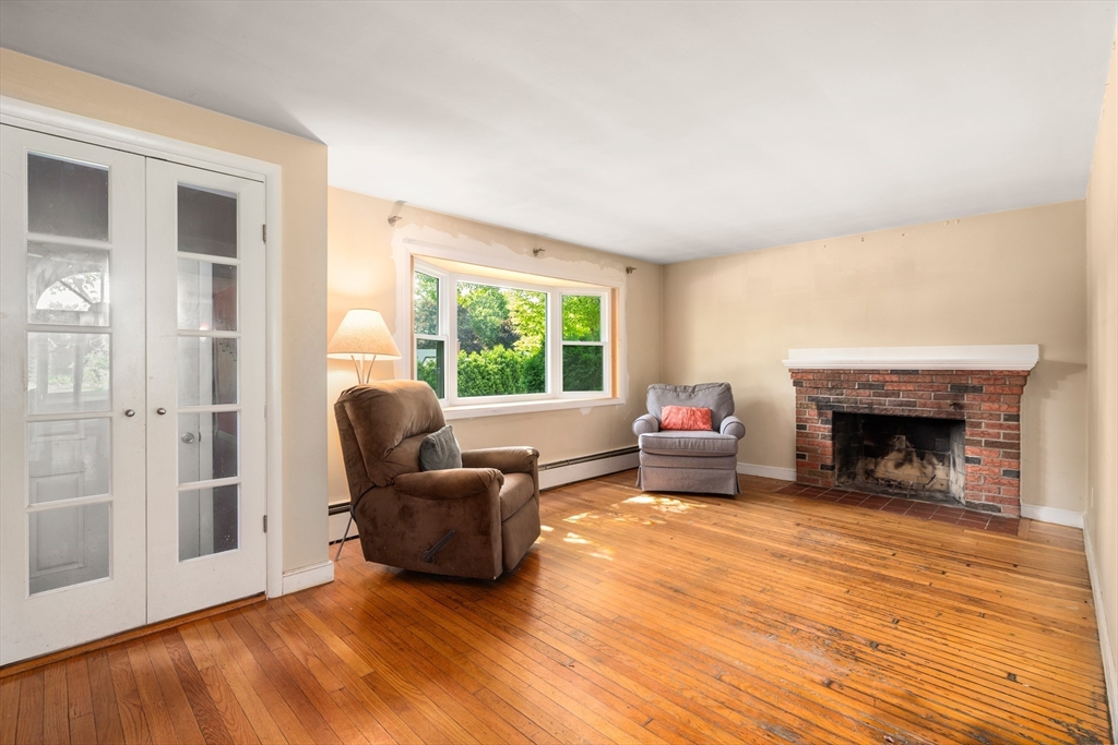 34 Irving Drive Walpole, MA 02081 - Photo 3 of 20 a living room with furniture and a fireplace