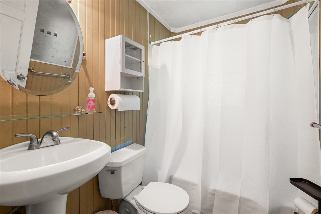 34 Irving Drive Walpole, MA 02081 - Photo 10 of 20 a bathroom with a sink toilet and shower