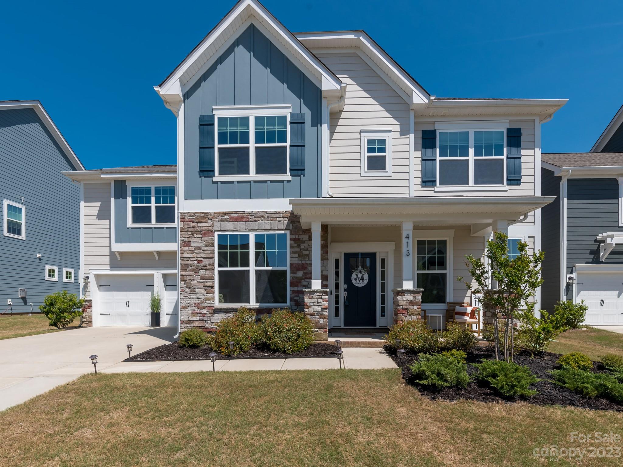 413 Hudson Place Davidson, NC 28036 - Photo 1 of 38 a front view of a house with a yard