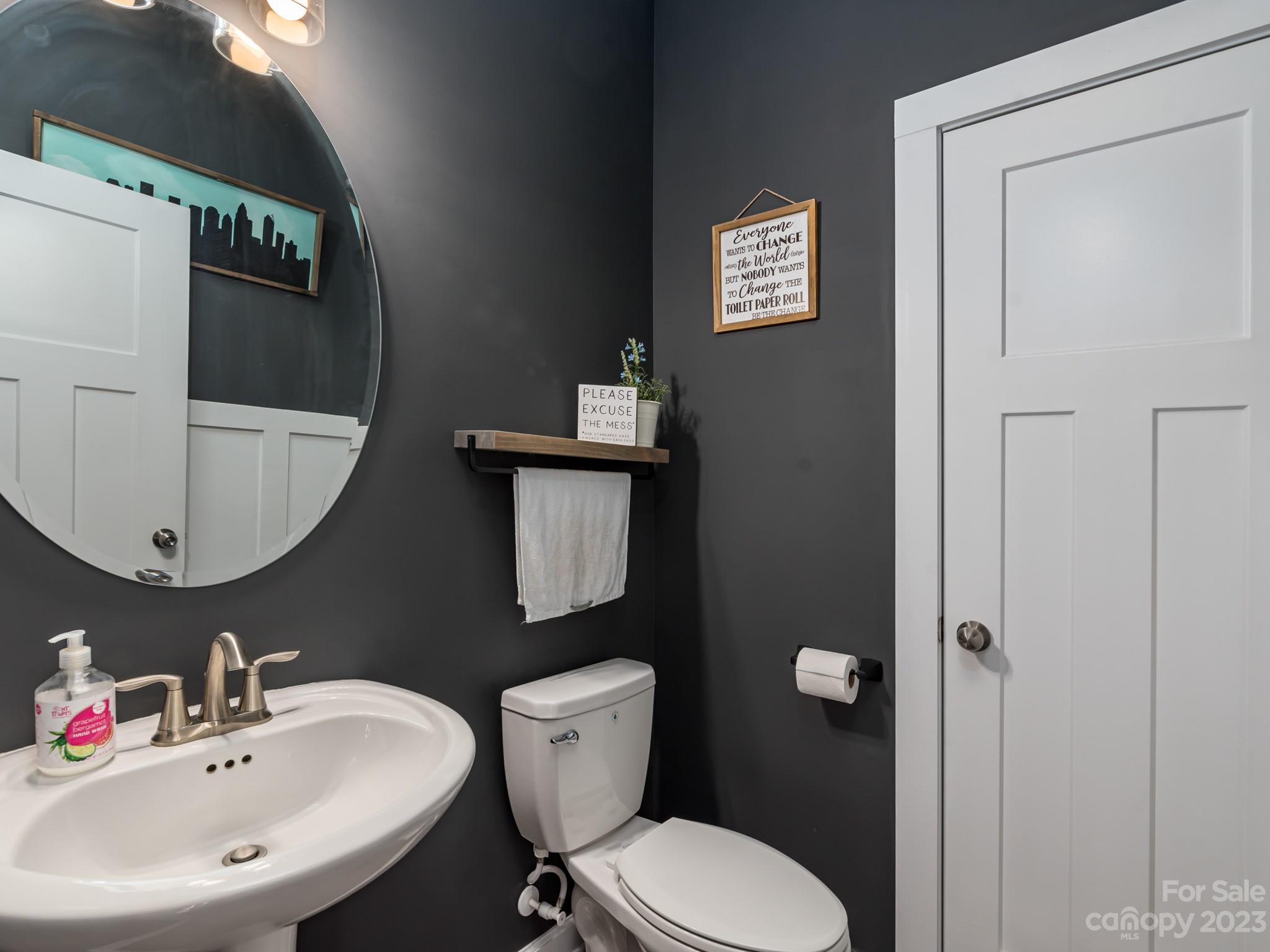 413 Hudson Place Davidson, NC 28036 - Photo 13 of 38 a bathroom with a toilet sink and mirror