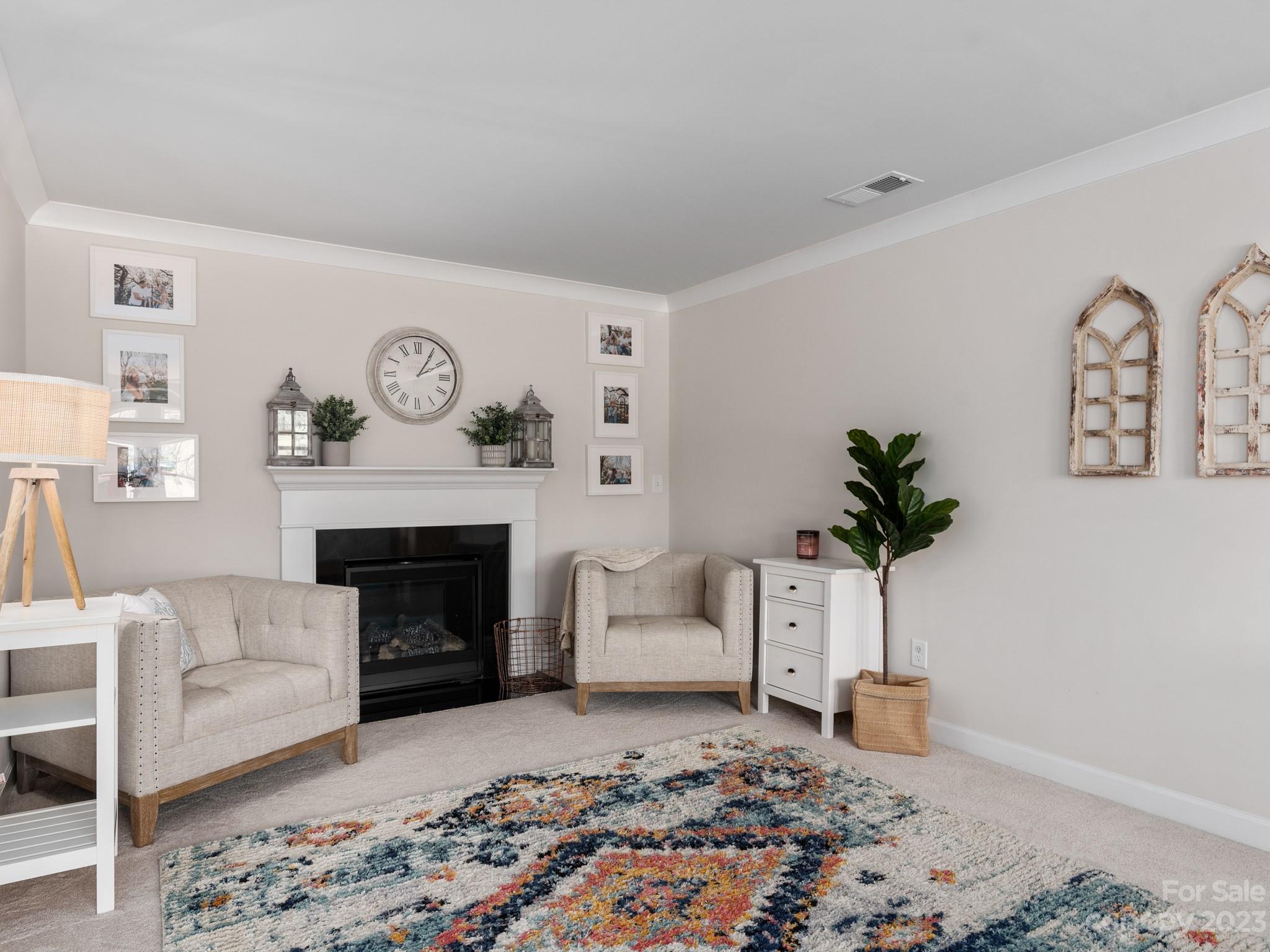 413 Hudson Place Davidson, NC 28036 - Photo 17 of 38 a living room with furniture and a fireplace