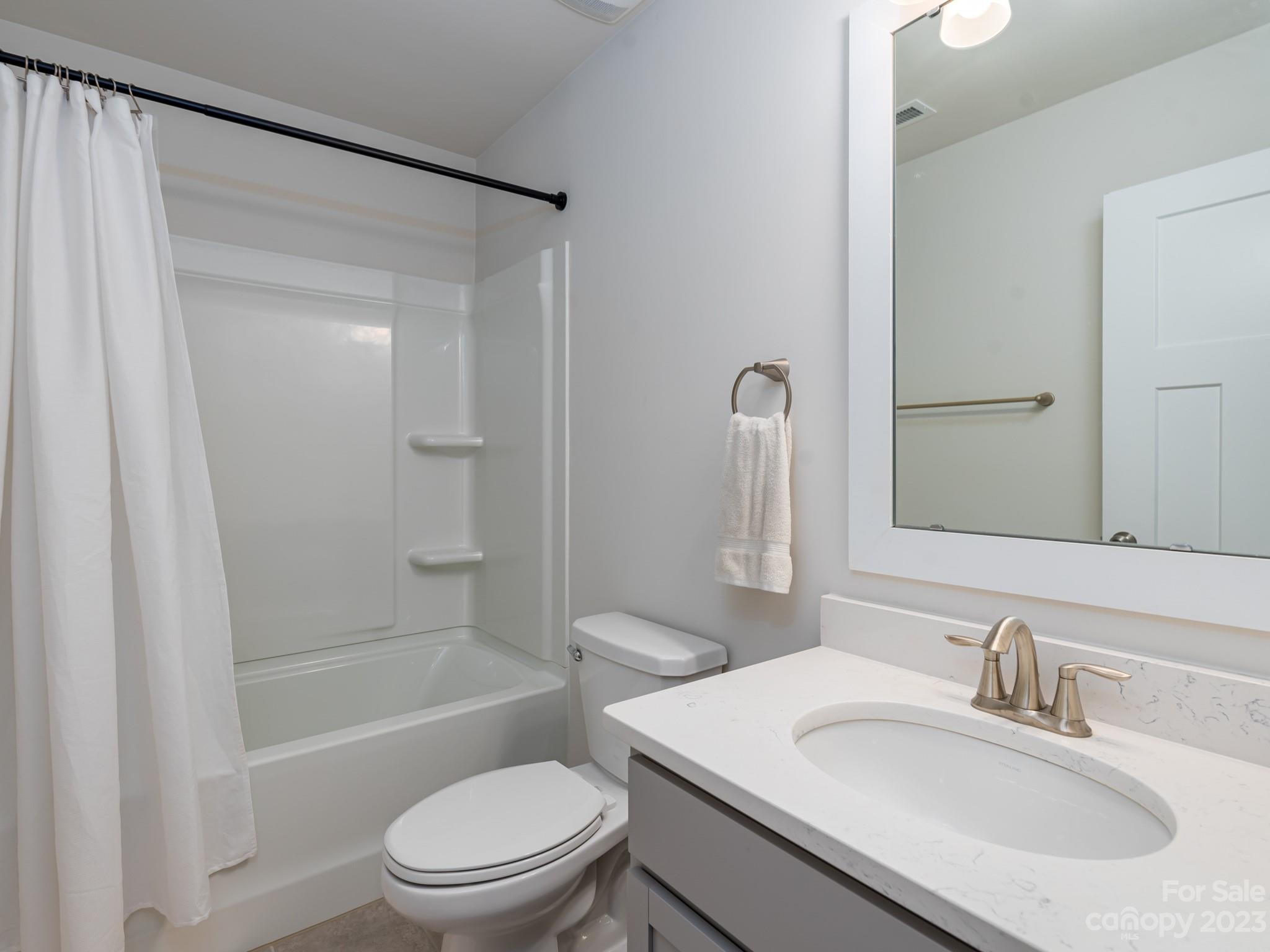 413 Hudson Place Davidson, NC 28036 - Photo 20 of 38 a bathroom with a sink toilet and shower