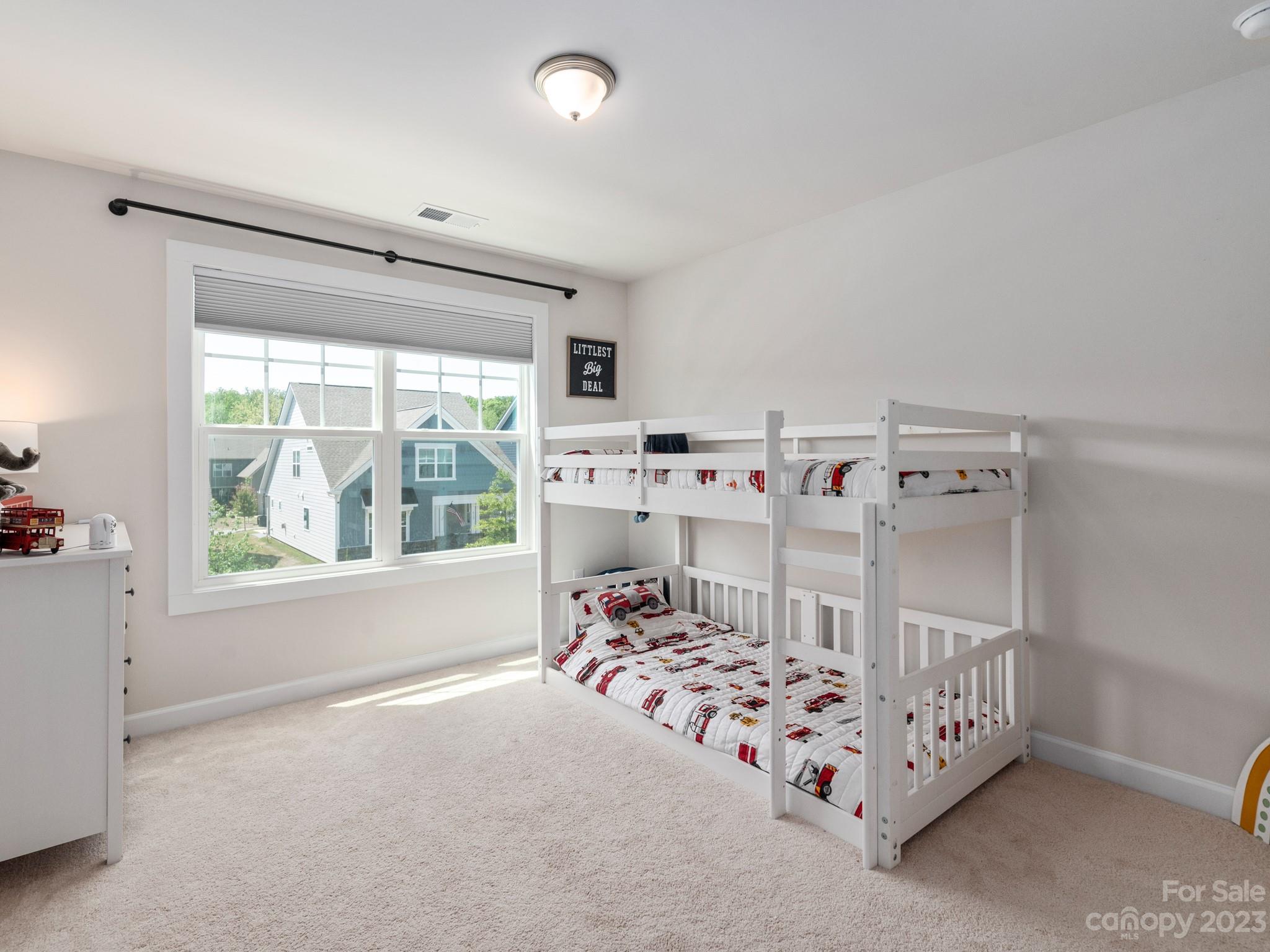 413 Hudson Place Davidson, NC 28036 - Photo 23 of 38 a bedroom with a bed and a window