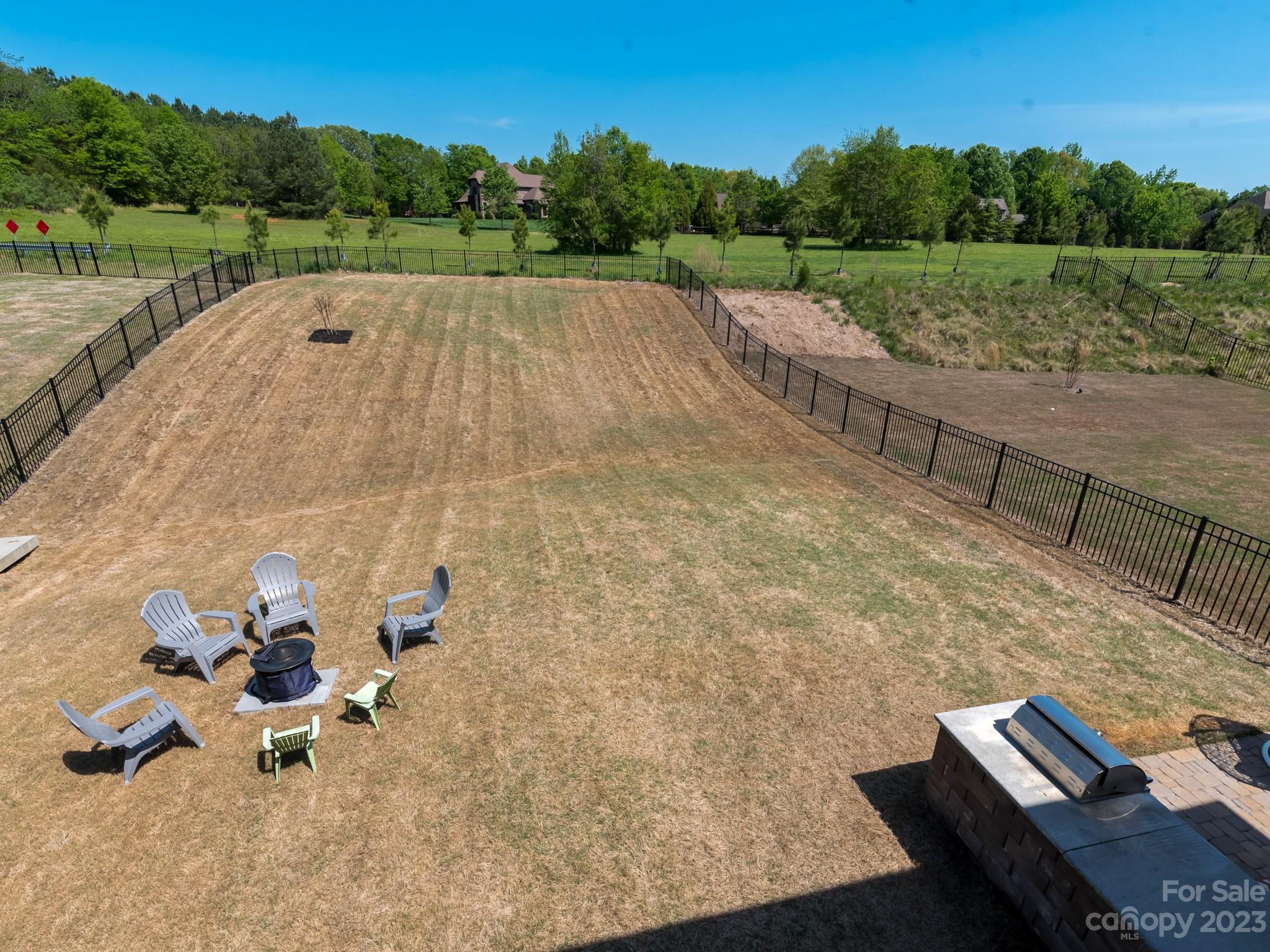 413 Hudson Place Davidson, NC 28036 - Photo 26 of 38 a view of a backyard with sitting area