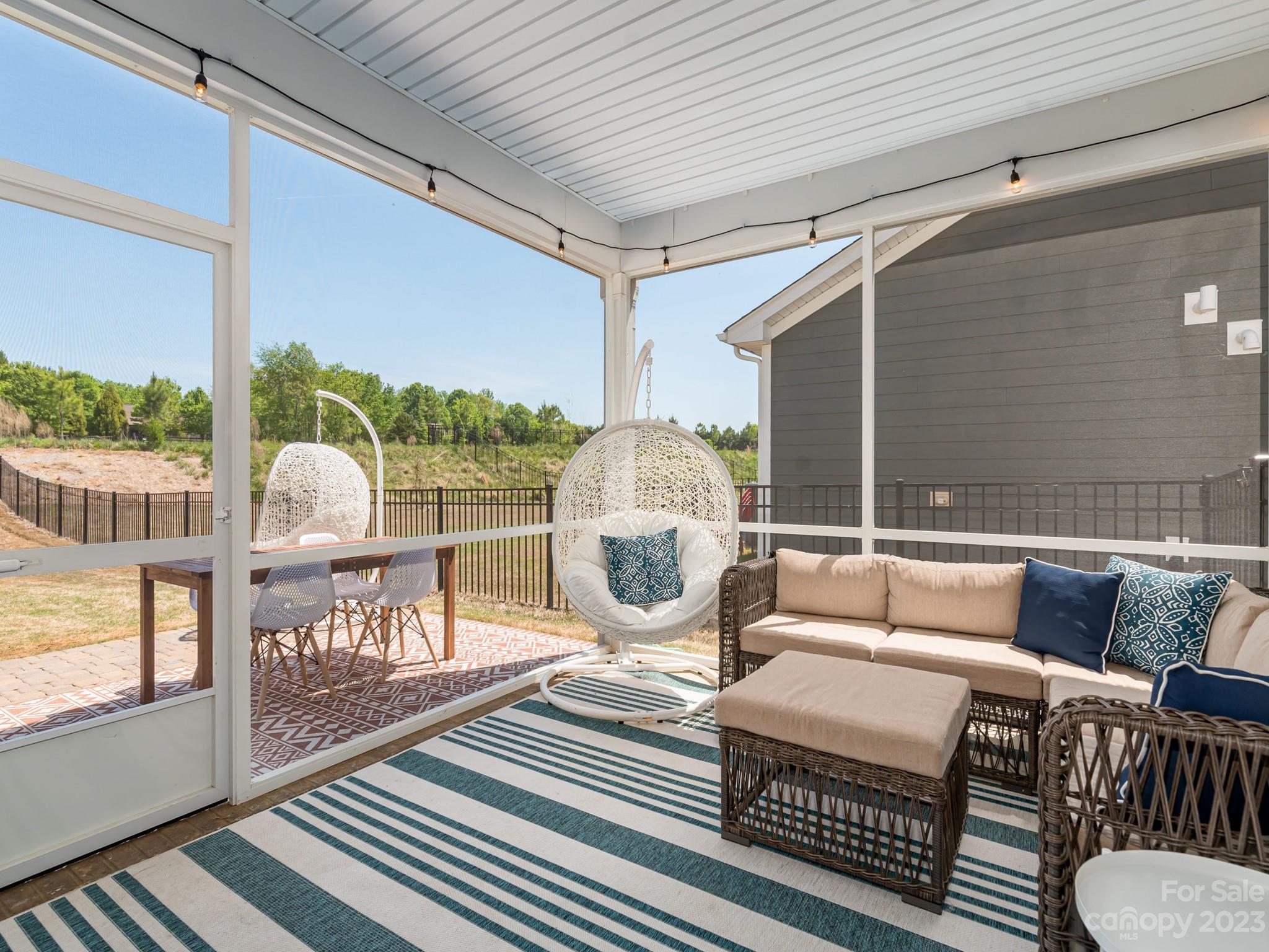 413 Hudson Place Davidson, NC 28036 - Photo 28 of 38 a living room with furniture and a table
