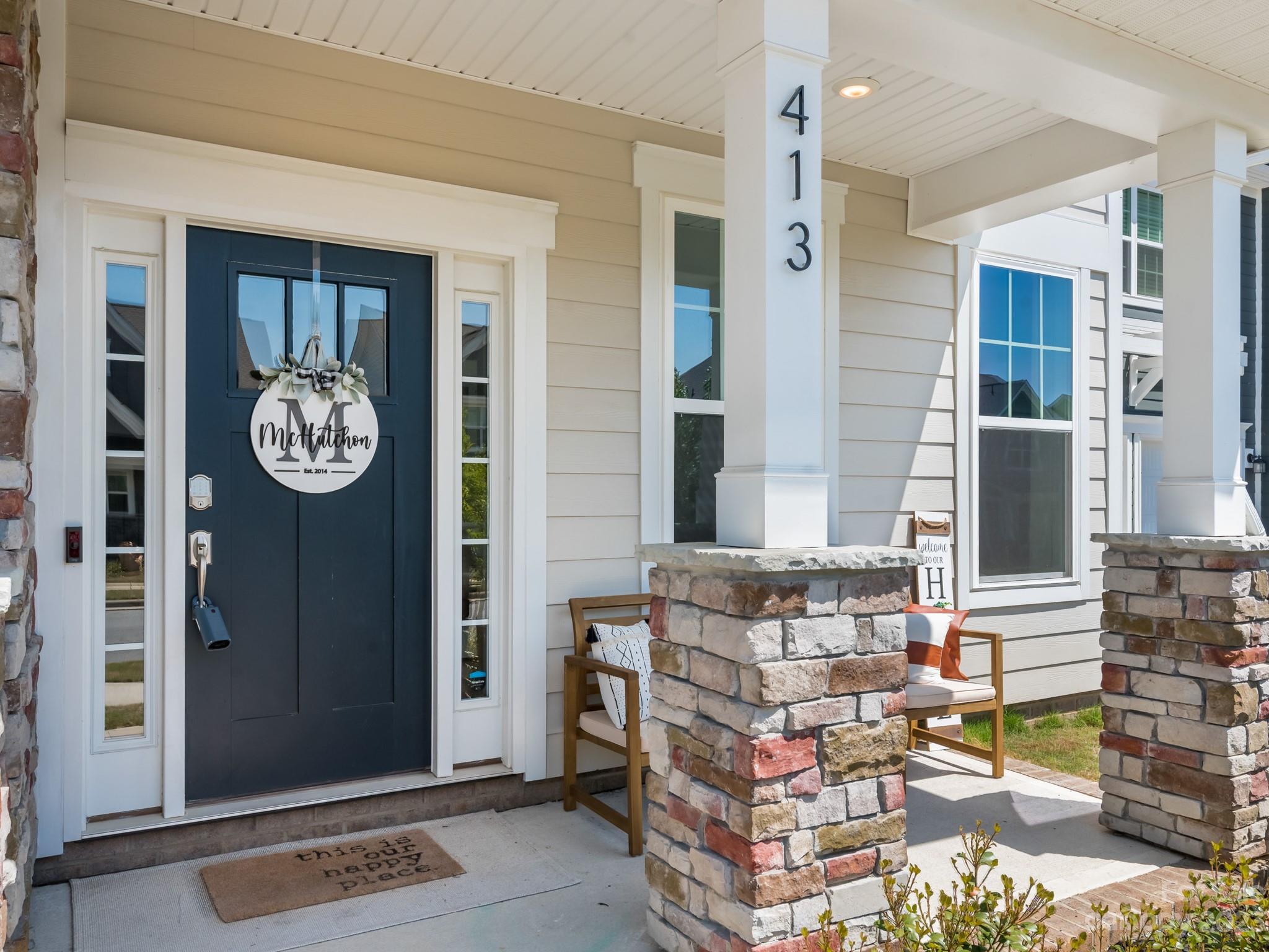 413 Hudson Place Davidson, NC 28036 - Photo 3 of 38 a living room with fireplace furniture and a window