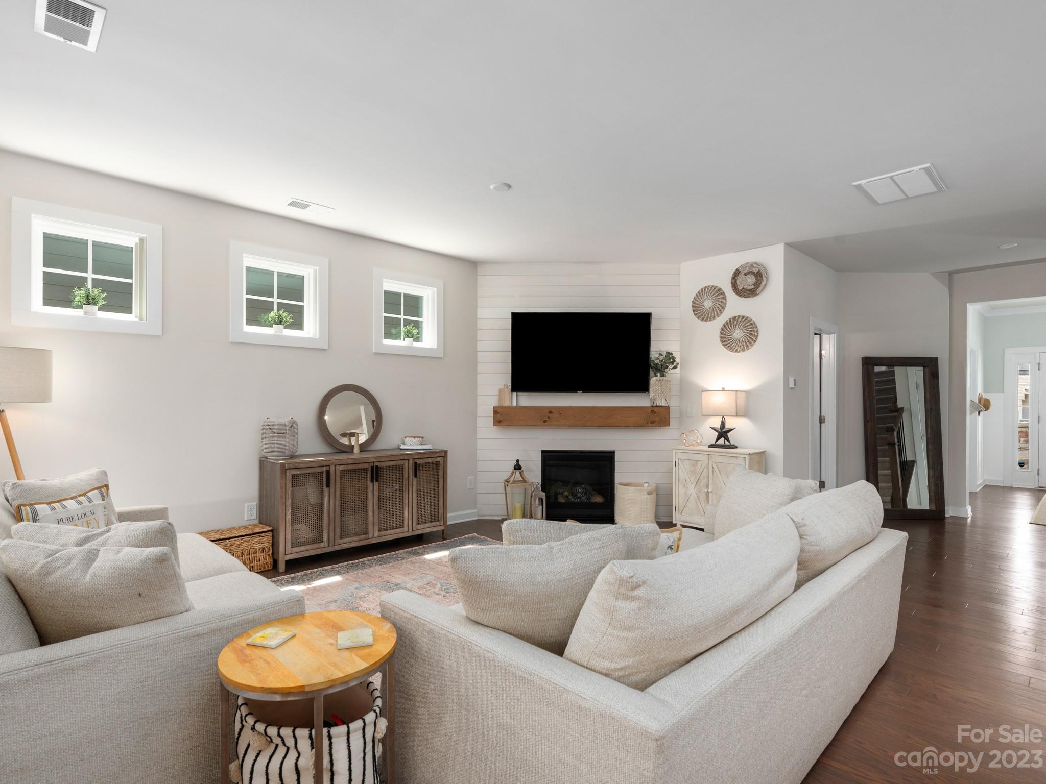 413 Hudson Place Davidson, NC 28036 - Photo 10 of 38 a living room with furniture and a flat screen tv