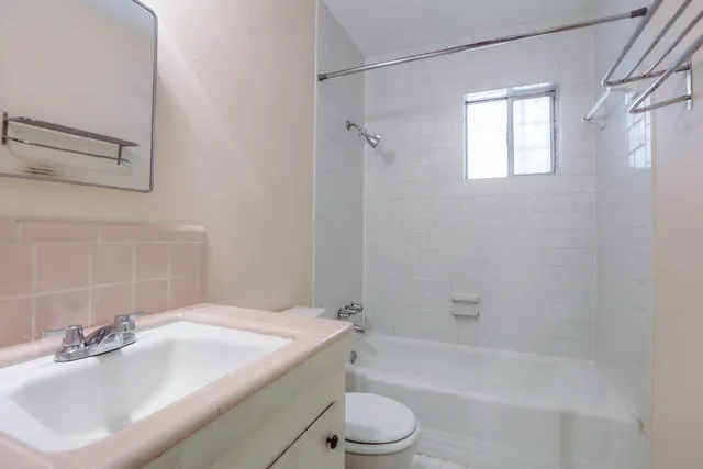 a bathroom with a sink toilet and bathtub