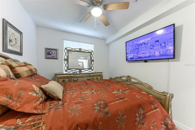 a front view of a building with cars parked