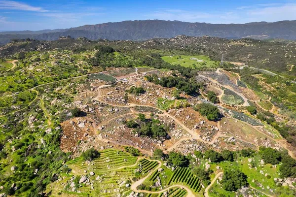 a view of a city with mountains in the background