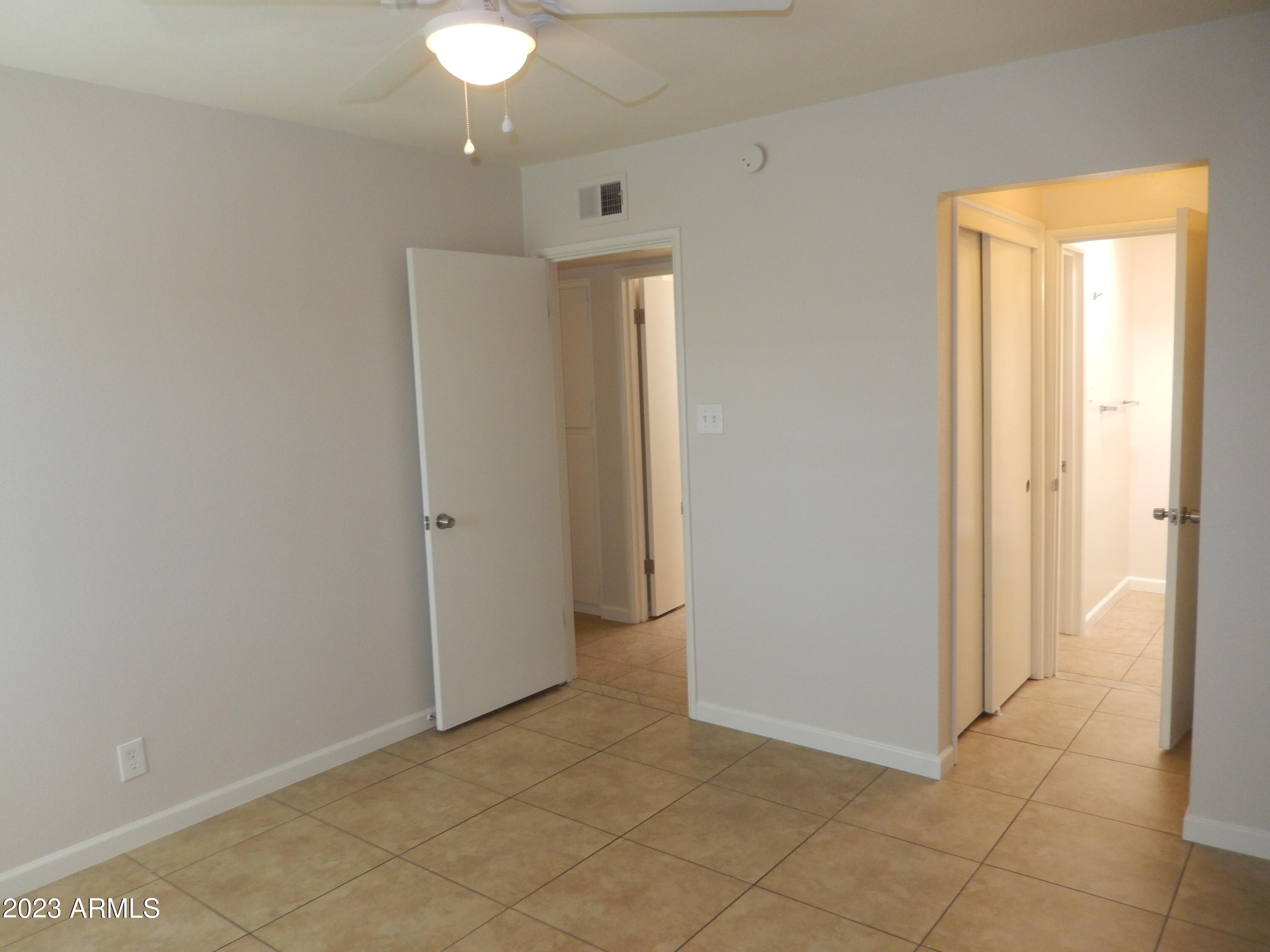 3618 East Montecito Avenue, Unit 2 Phoenix, AZ 85018 - Photo 9 of 17 a view of an empty room with a bathroom