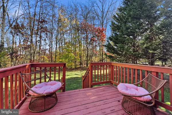 a view of a two chairs in the deck
