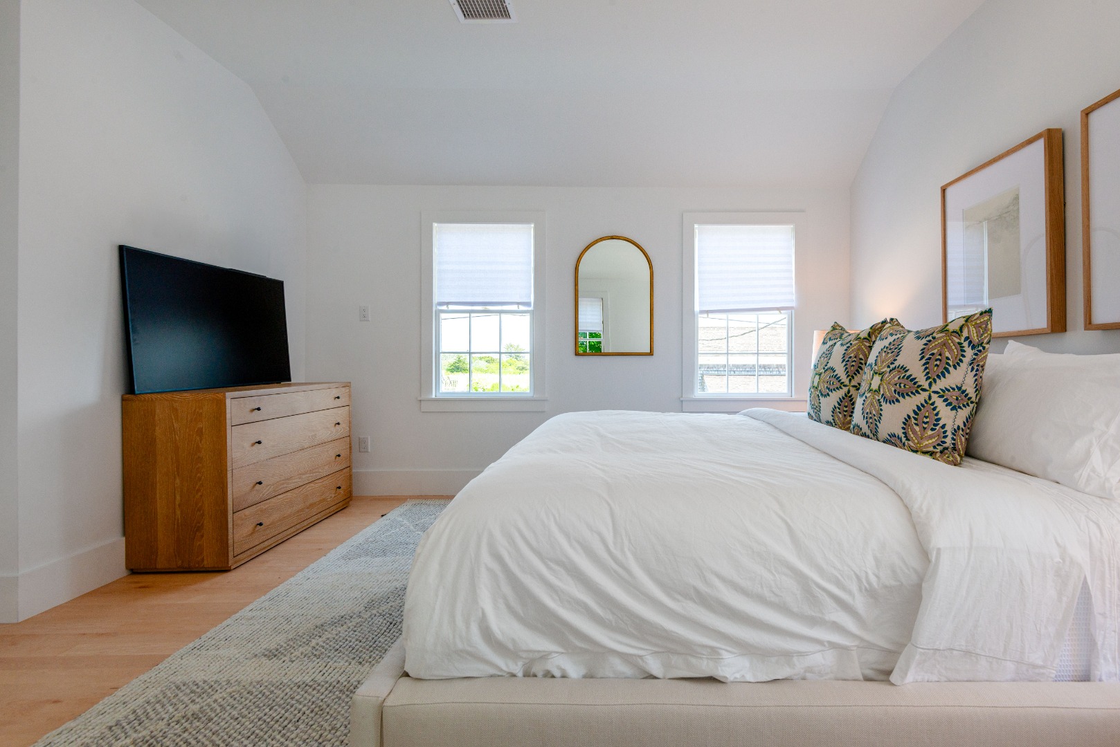 12 Willard Street Nantucket, MA 02554 - Photo 27 of 36 a bedroom with a bed and a flat screen tv