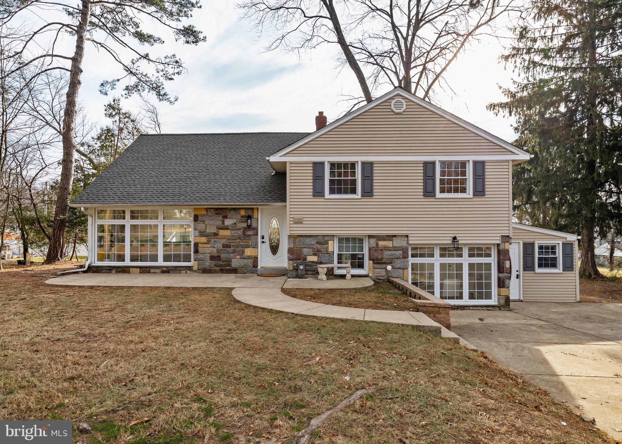 1221 Huntingdon Pike Huntingdon Valley, PA 19006 - Photo 1 of 48 a front view of a house with a yard and garage