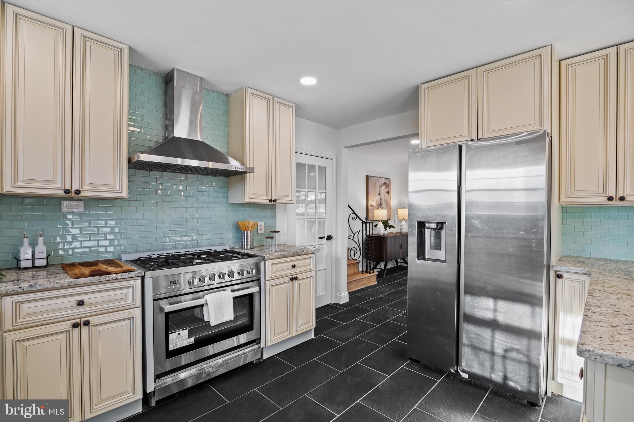 1221 Huntingdon Pike Huntingdon Valley, PA 19006 - Photo 16 of 48 a kitchen with stainless steel appliances granite countertop a stove a refrigerator and a cabinets