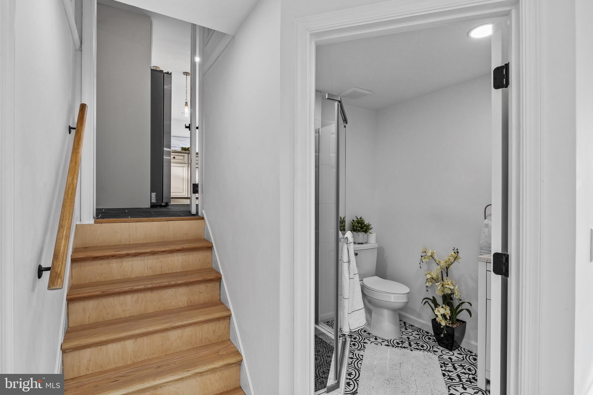 1221 Huntingdon Pike Huntingdon Valley, PA 19006 - Photo 17 of 48 a view of a hallway with wooden floor and a living room