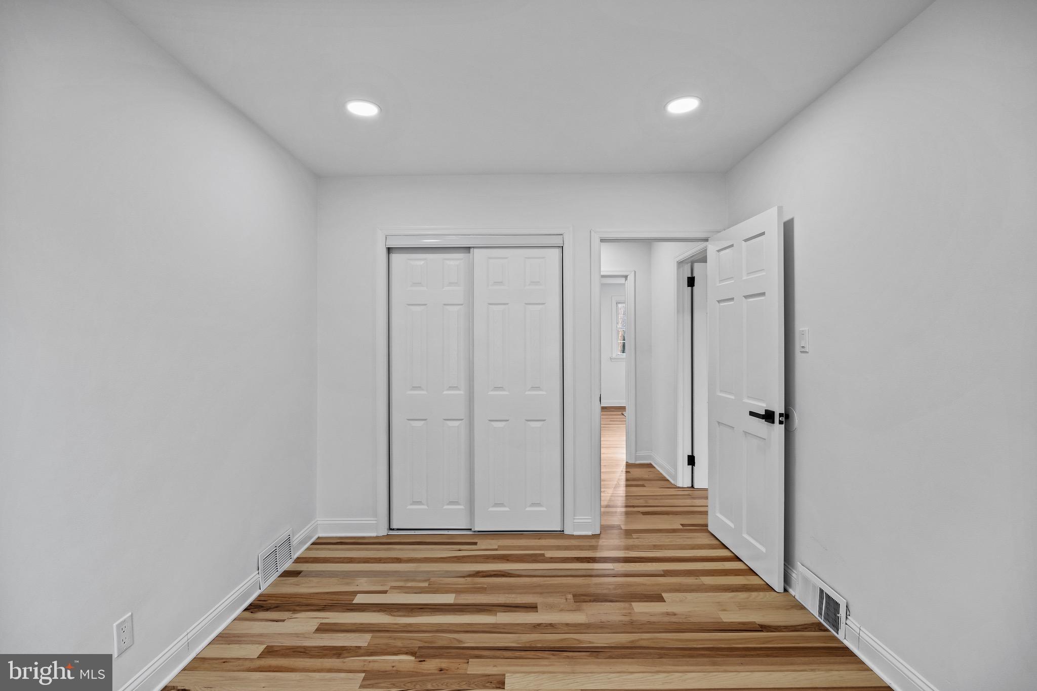 1221 Huntingdon Pike Huntingdon Valley, PA 19006 - Photo 20 of 48 a view of a hallway with wooden floor and closet