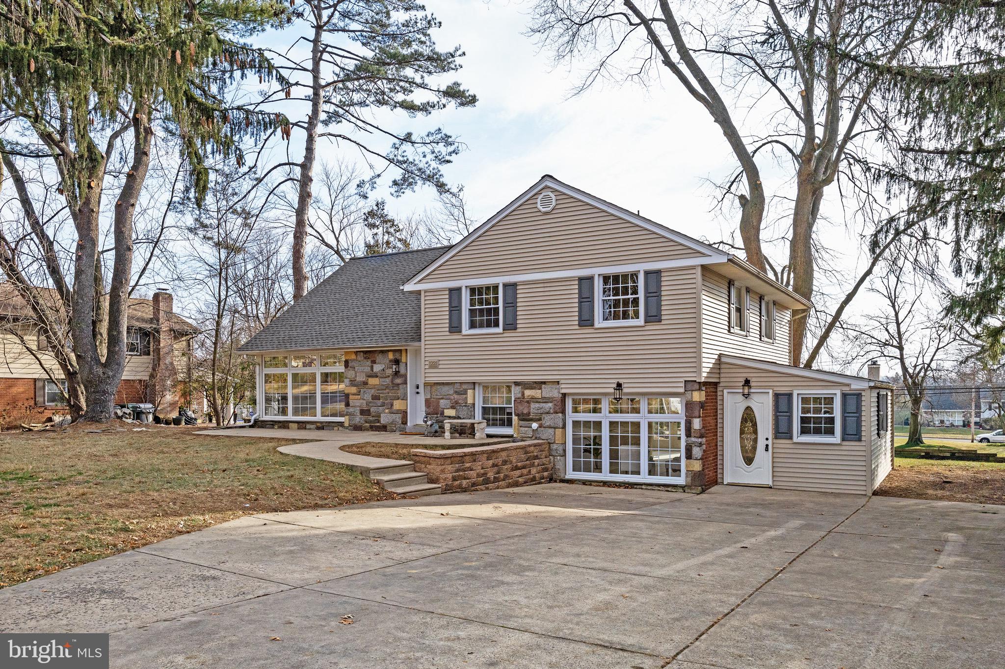 1221 Huntingdon Pike Huntingdon Valley, PA 19006 - Photo 22 of 48 a front view of a house with a garden