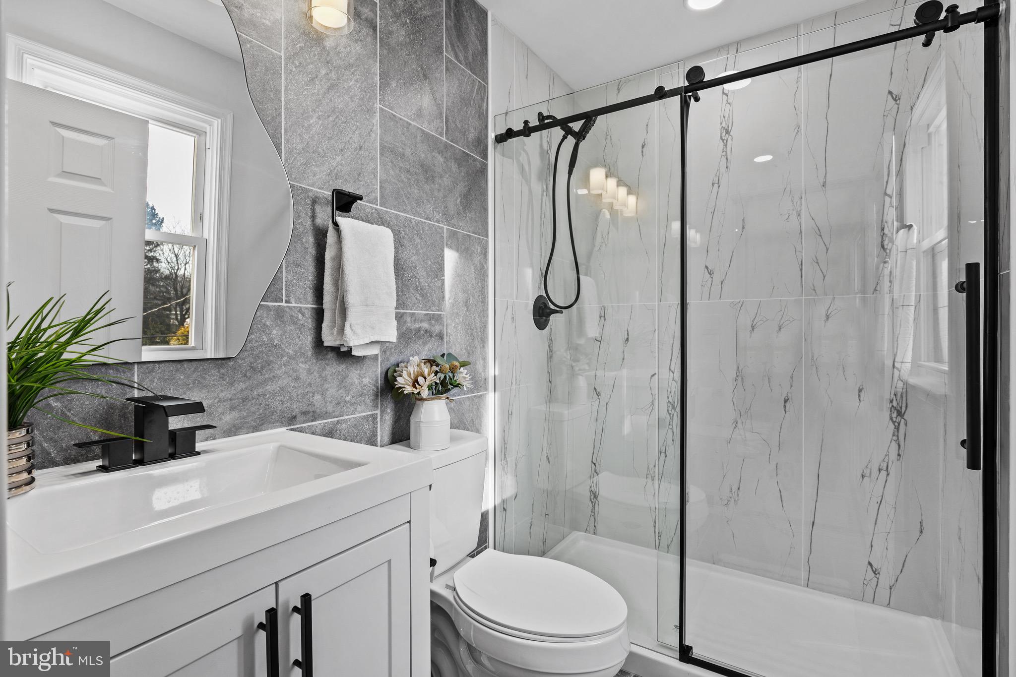 1221 Huntingdon Pike Huntingdon Valley, PA 19006 - Photo 28 of 48 a bathroom with a sink a toilet and shower